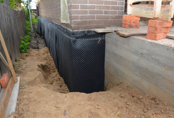 Happy homeowners after waterproofing job in Morgantown